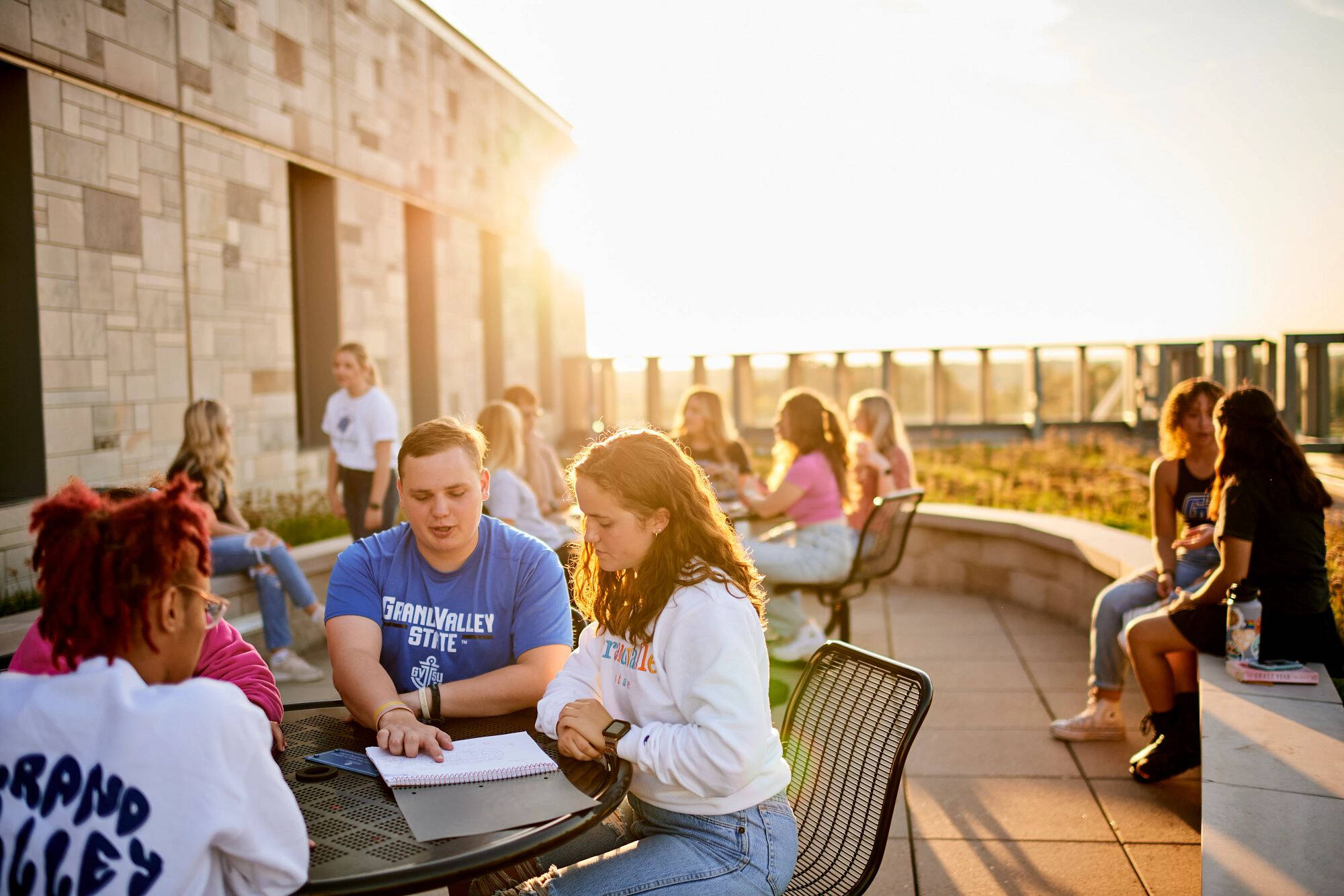 GVSU students on top of library roof.